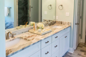 double sinks in a granite countertop bathroom