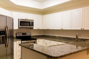 granite kitchen countertop with cabinets
