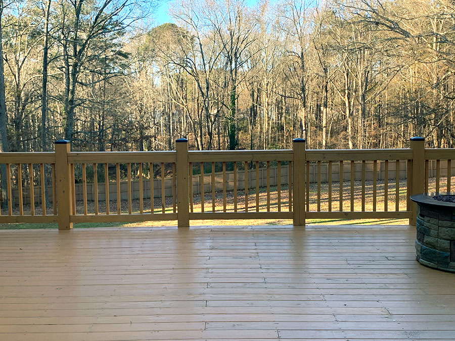 New deck with fire pit overlooking the backyard