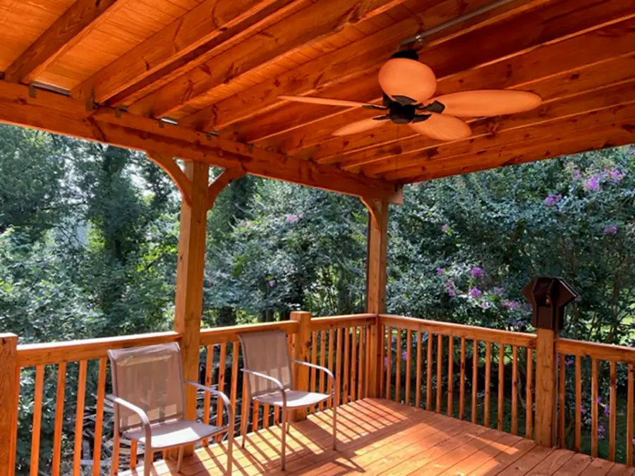 wooden deck with covered patio and fan in grayson georgia